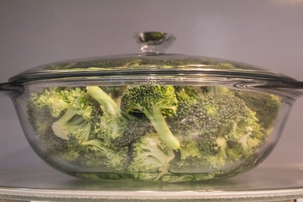 Broccoli florets in microwave safe dish.