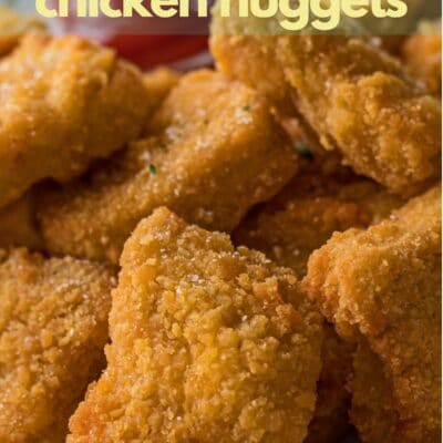 Plated air fryer chicken nuggets pin with text header.