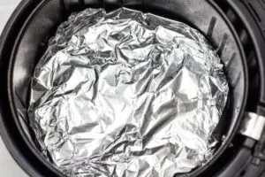 Aluminum foil-lined air fryer basket.