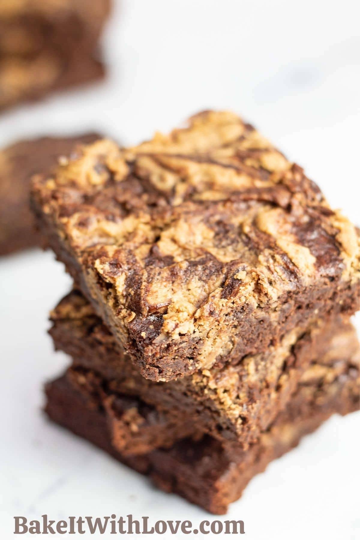 Marbled peanut butter banana brownie squares stacked.