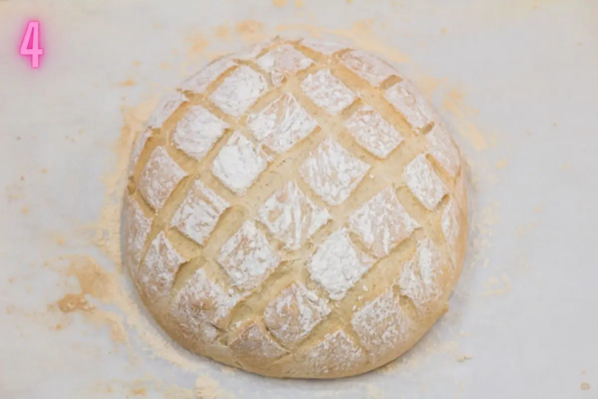 Process photo of the baked cob loaf after removing from the oven.