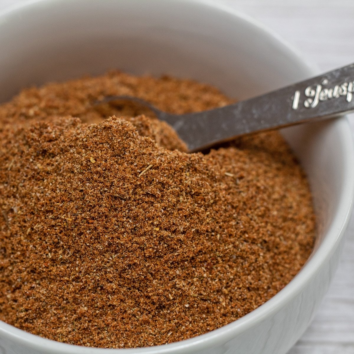 Cajun seasoning blend in a white bowl.