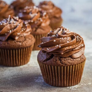Mary Berry's chocolate cupcakes baked up and piped with chocolate buttercream frosting.
