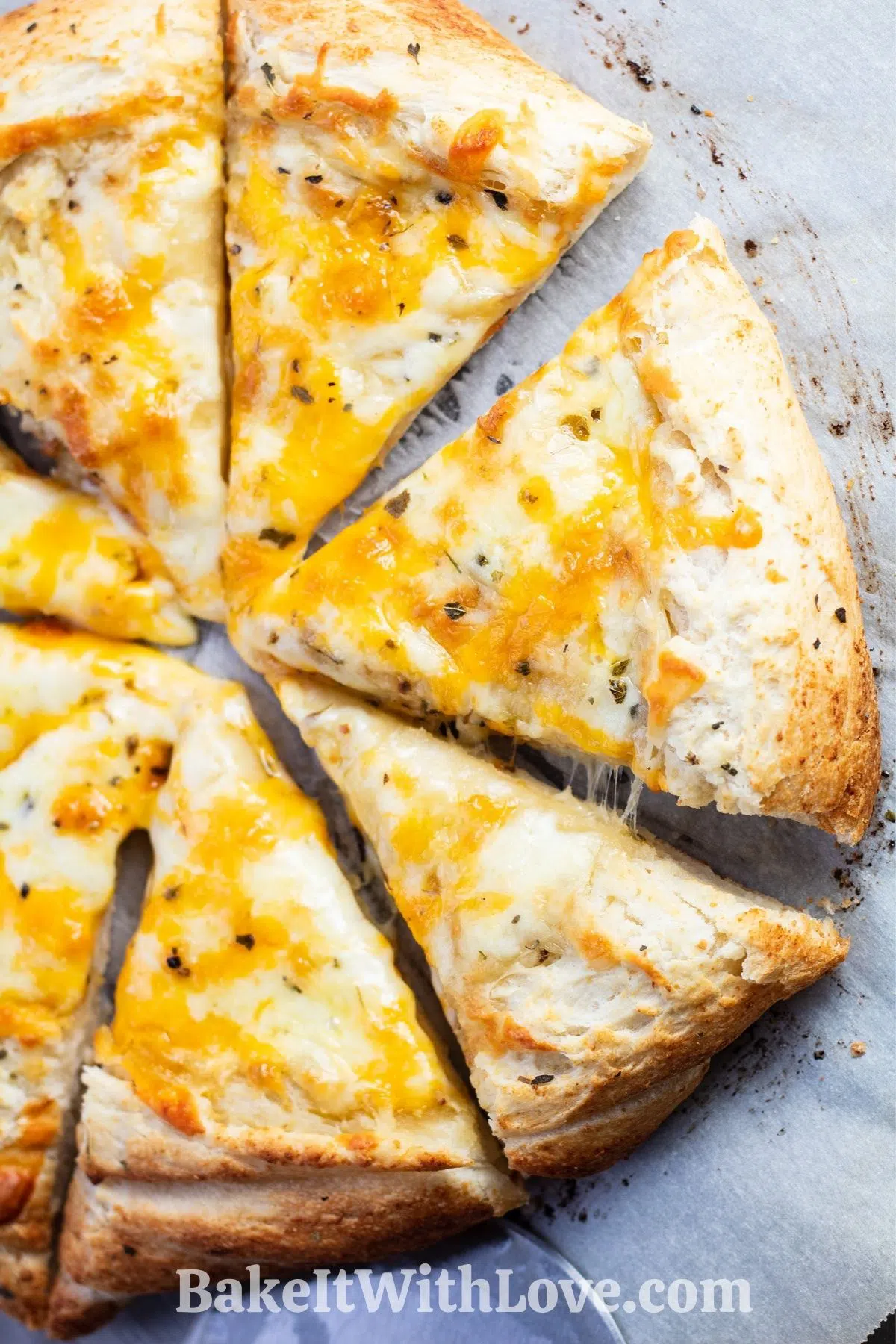 Easy, cheesy garlic pizza sliced and served.