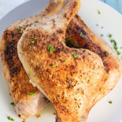 Baked chicken quarters or chicken leg quarters pin with text header.