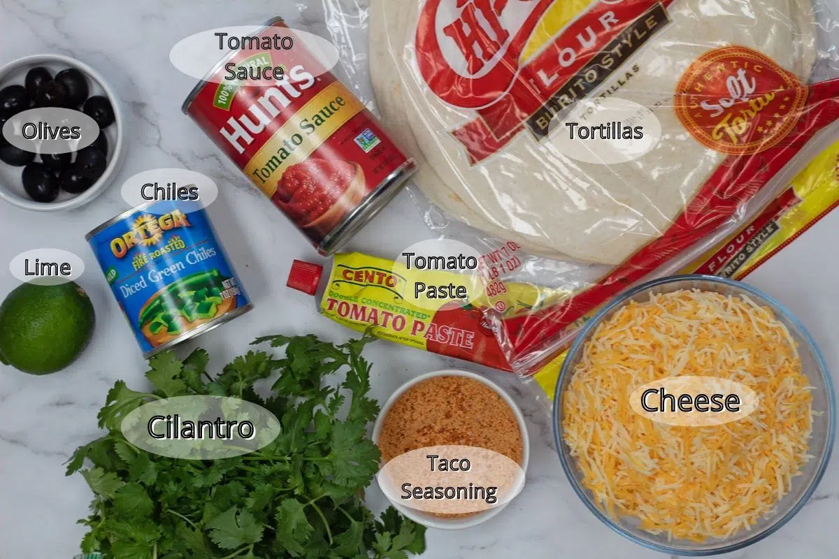 Cheese enchiladas ingredients needed to make the enchiladas and sauce.