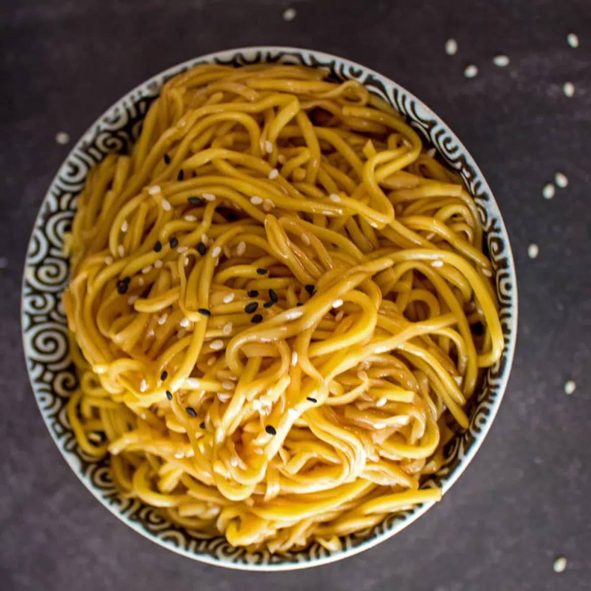 Top down photo showing bowl of hibachi noodles with sesame seeds.
