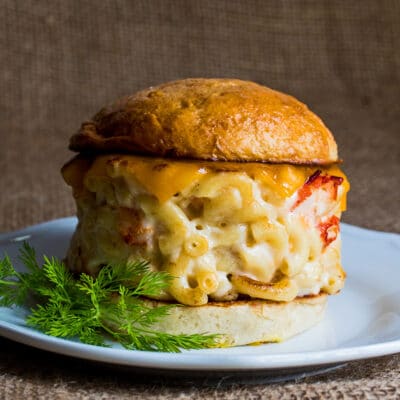 Lobster mac and cheese burger served on brioche bun.