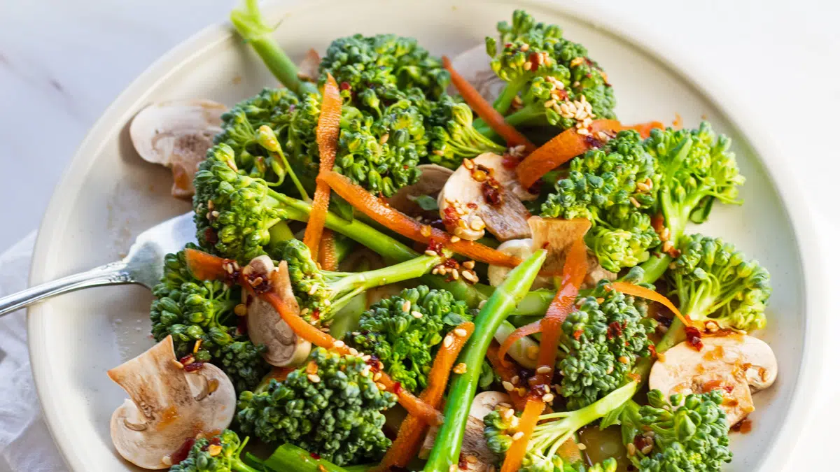 Wide image of the broccolini salad with Asian dressing.