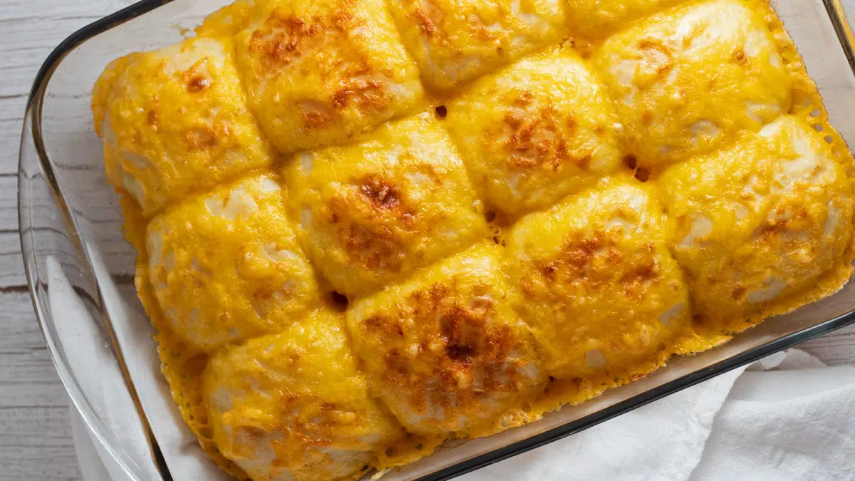 Overhead of the baked cheese rolls in glass baking pan.