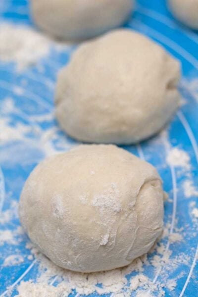 Process photo 7 of the divided dough portions shaped into balls.