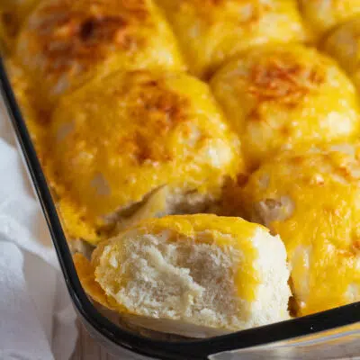 Cheese rolls baked until golden brown and shown here as they are cooling in the pan.