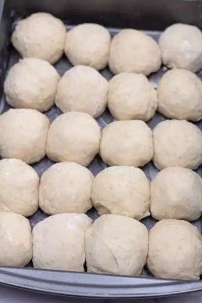 Process photo 9 of the portioned and shape balls of dough.