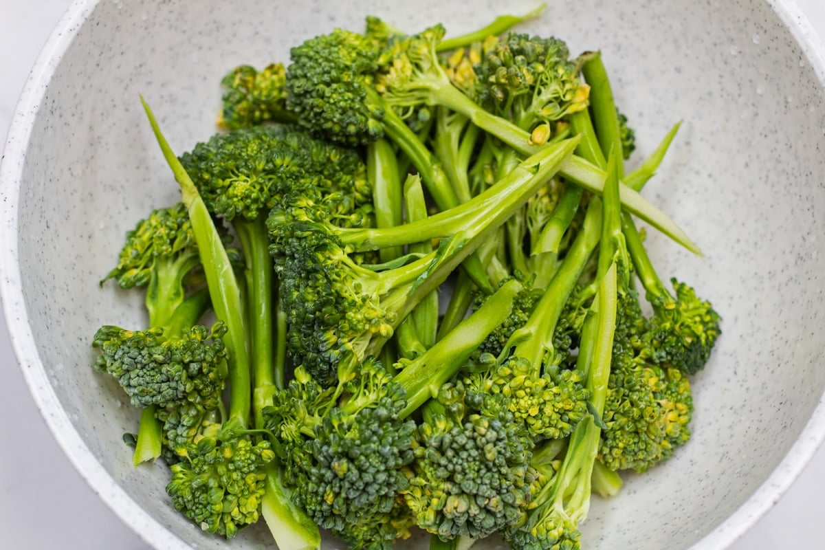 Broccolini washed and trimmed in bowl.