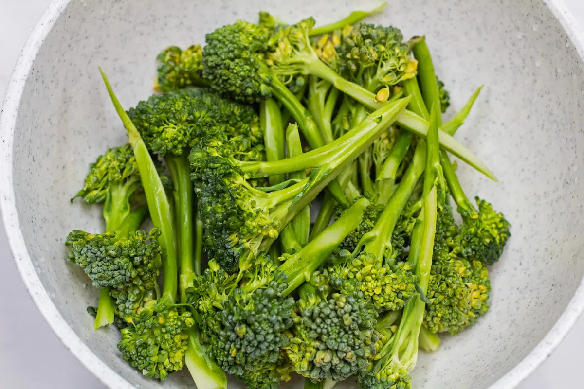 Broccolini washed and trimmed in bowl.