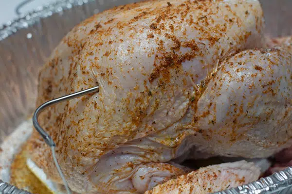 Process photo 4 of the temperature probe inserted into the turkey breast.