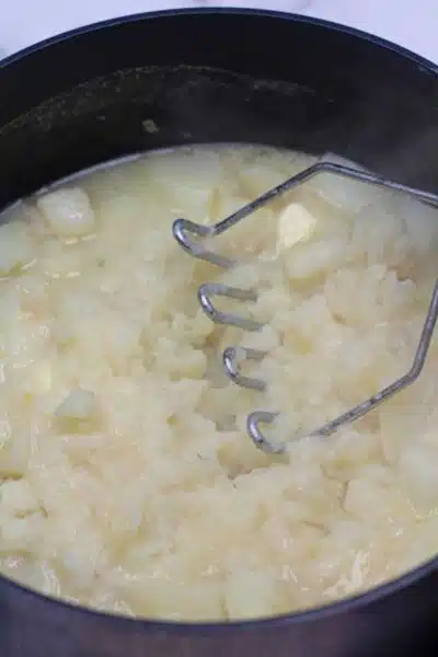Process photo 6 mashing the boiled potatoes.