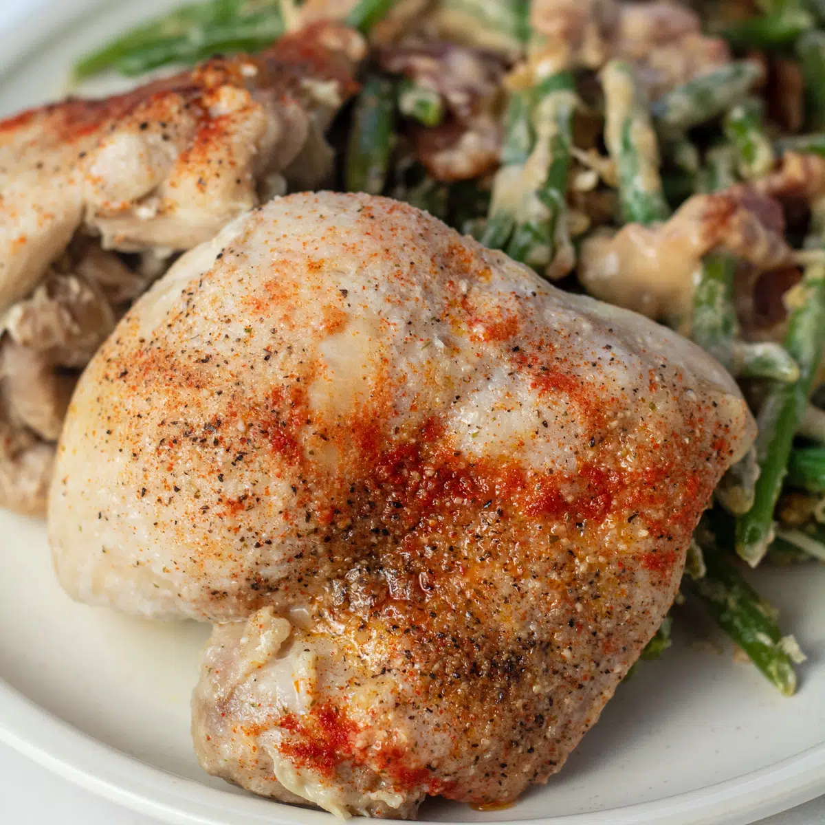 Instant pot chicken thighs served with green beans.