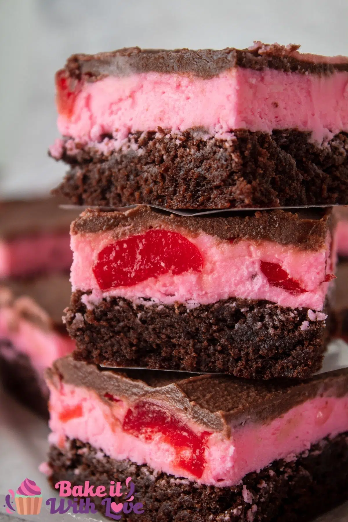 Image of maraschino cherry brownies stacked on top of each other.