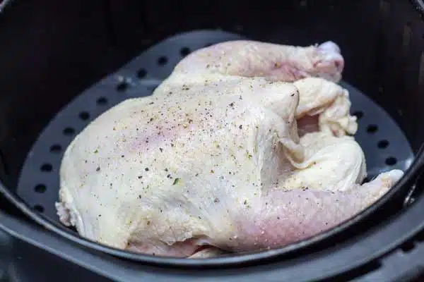 Process photo 1 seasoned cornish hen ready to air fry.