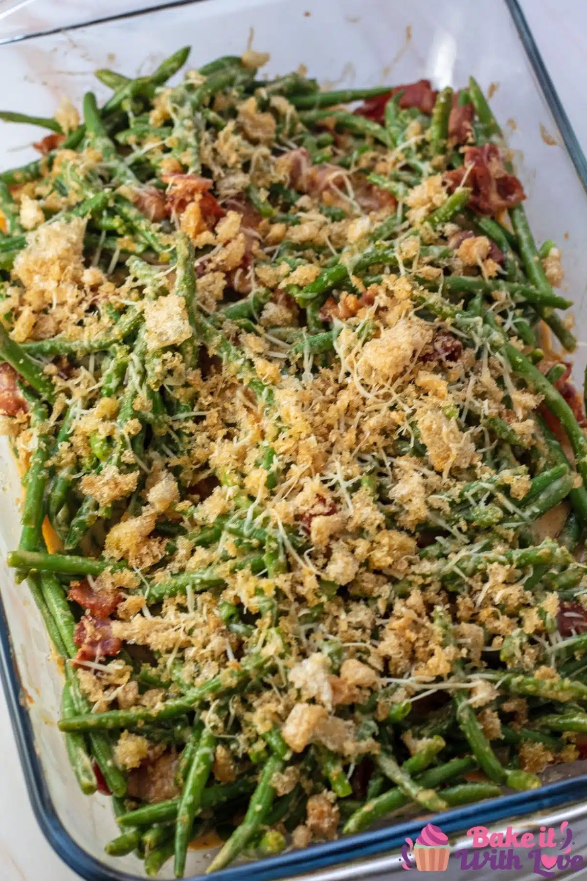 Tall overhead image of the baked green bean casserole with bacon.