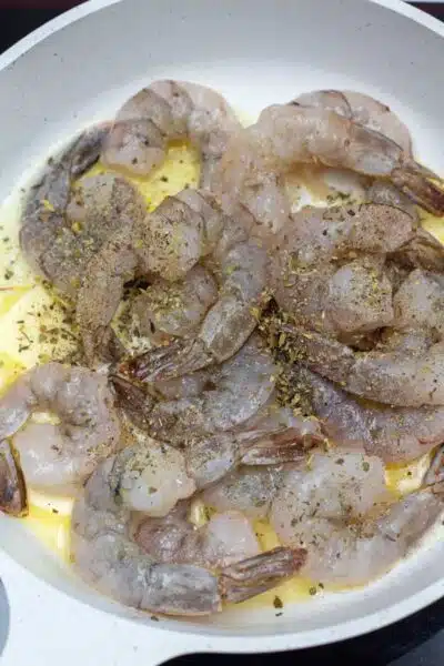 Process photo 1 seasoned shrimp in skillet.