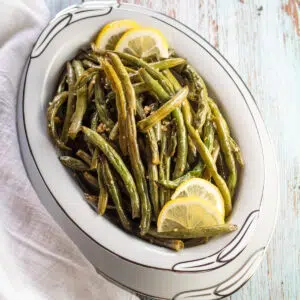 Oven roasted green beans in serving bowl.