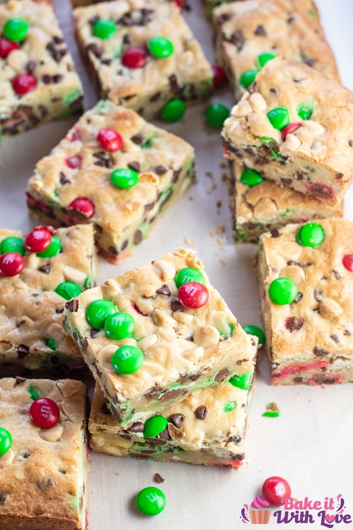 Tall image of the sliced Christmas MM cookie bars.