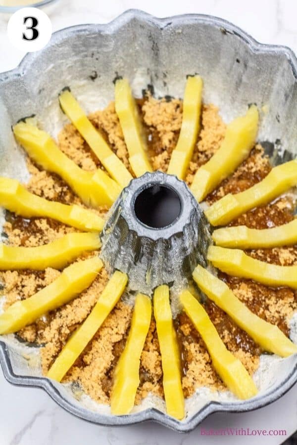 Pineapple upside down bundt cake process photo 3 arrange the halved pineapple slices in the grooves of the bundt pan.