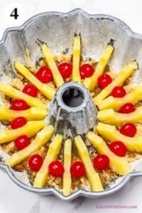 Pineapple upside down bundt cake process photo 4 arrange the maraschino cherries between pineapple slices.