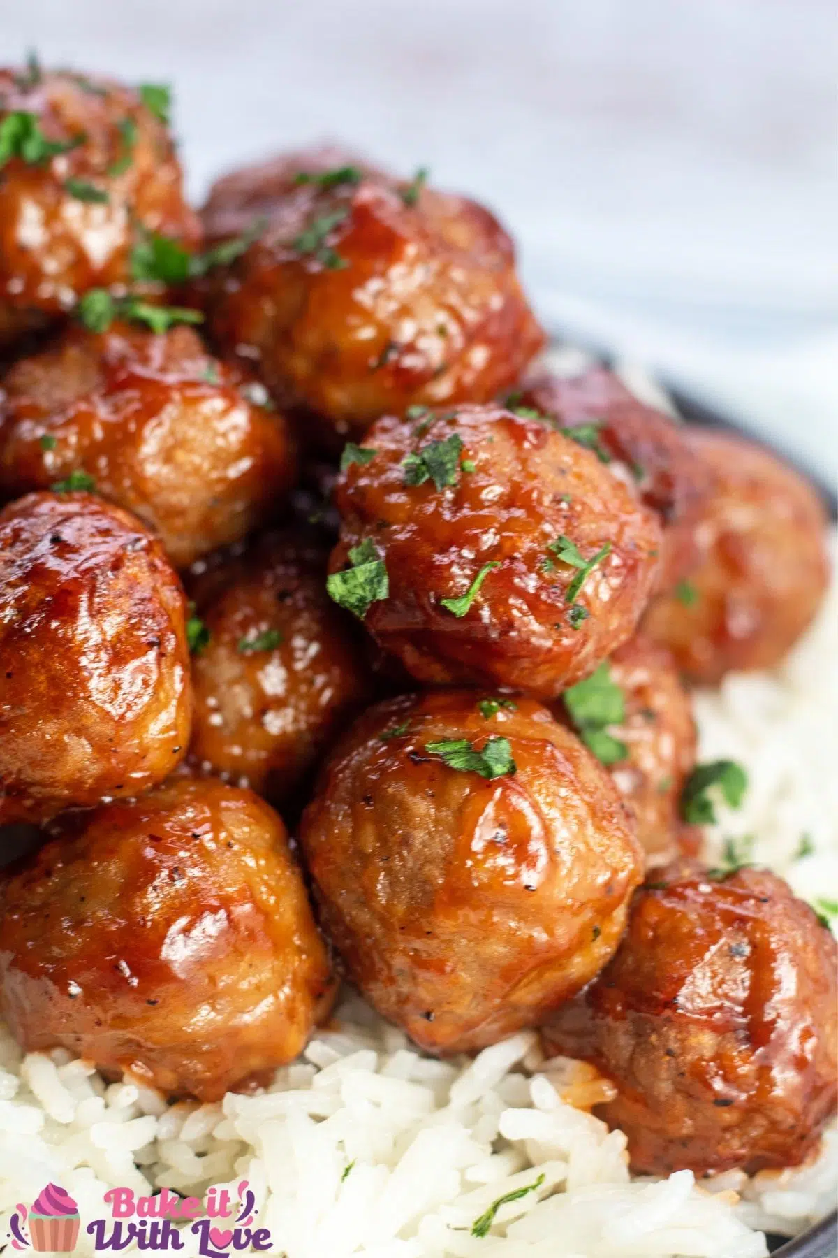 Tall side view of the air fryer frozen meatballs plated with rice.