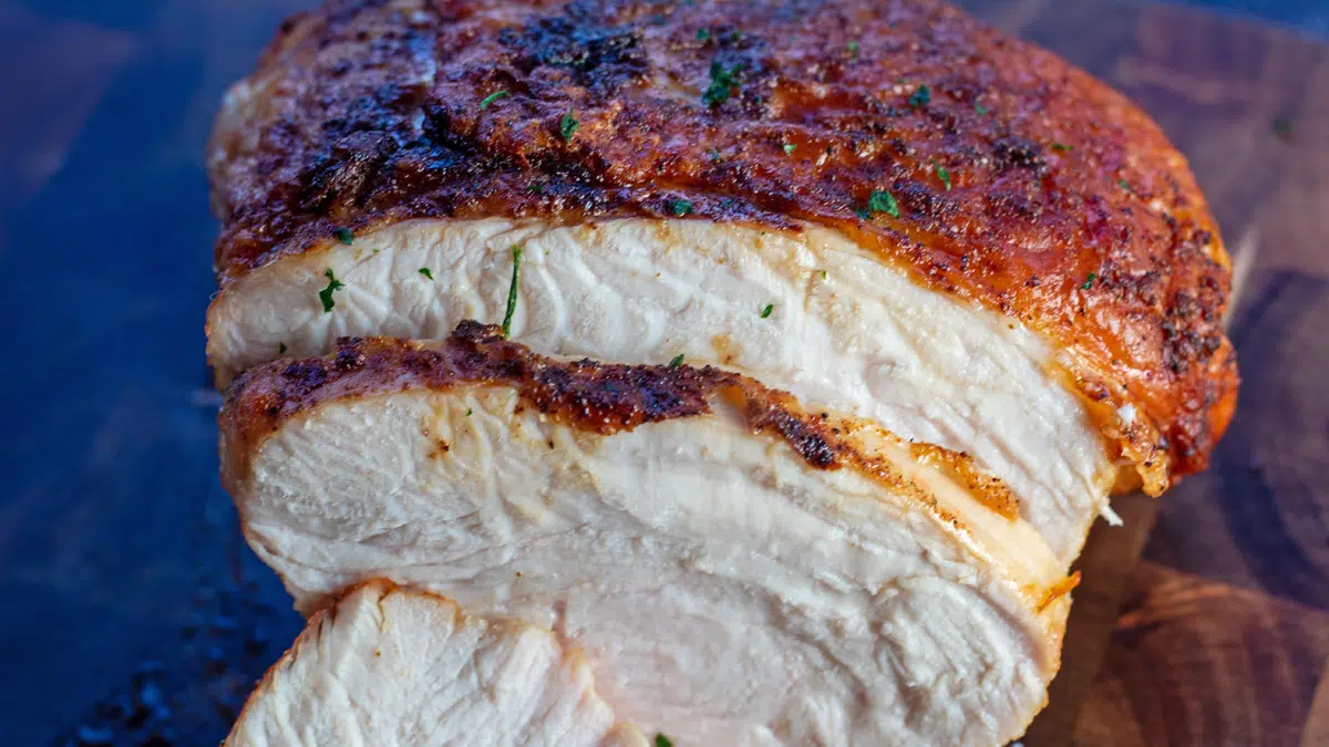 Wide image of the sliced air fryer turkey breast.