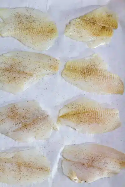 Process photo 3 flounder fillets on baking sheet.