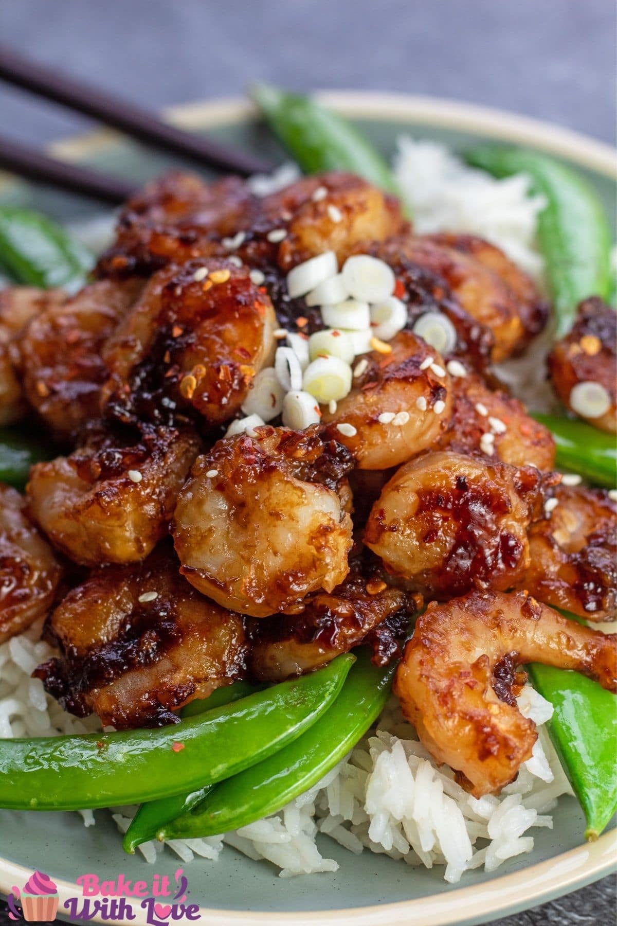 Tall image of the General Tso's shrimp on sage colored plate.