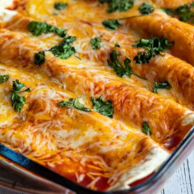 Leftover turkey enchiladas topped with melted cheeses and cilantro.