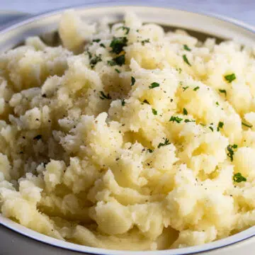 Wide image of the mashed potatoes in serving dish.