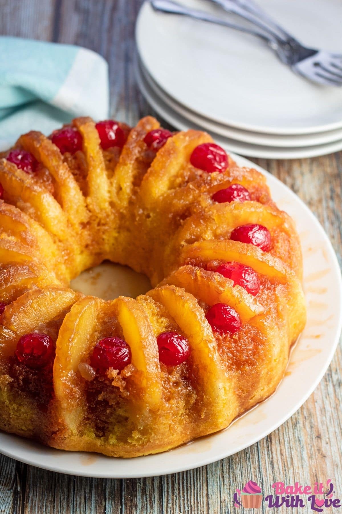 Tall image of the pineapple upside down bundt cake before slicing and serving.