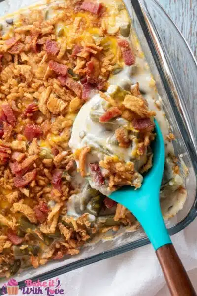 Tall overhead image of the bacon cheddar green bean casserole in baking dish.