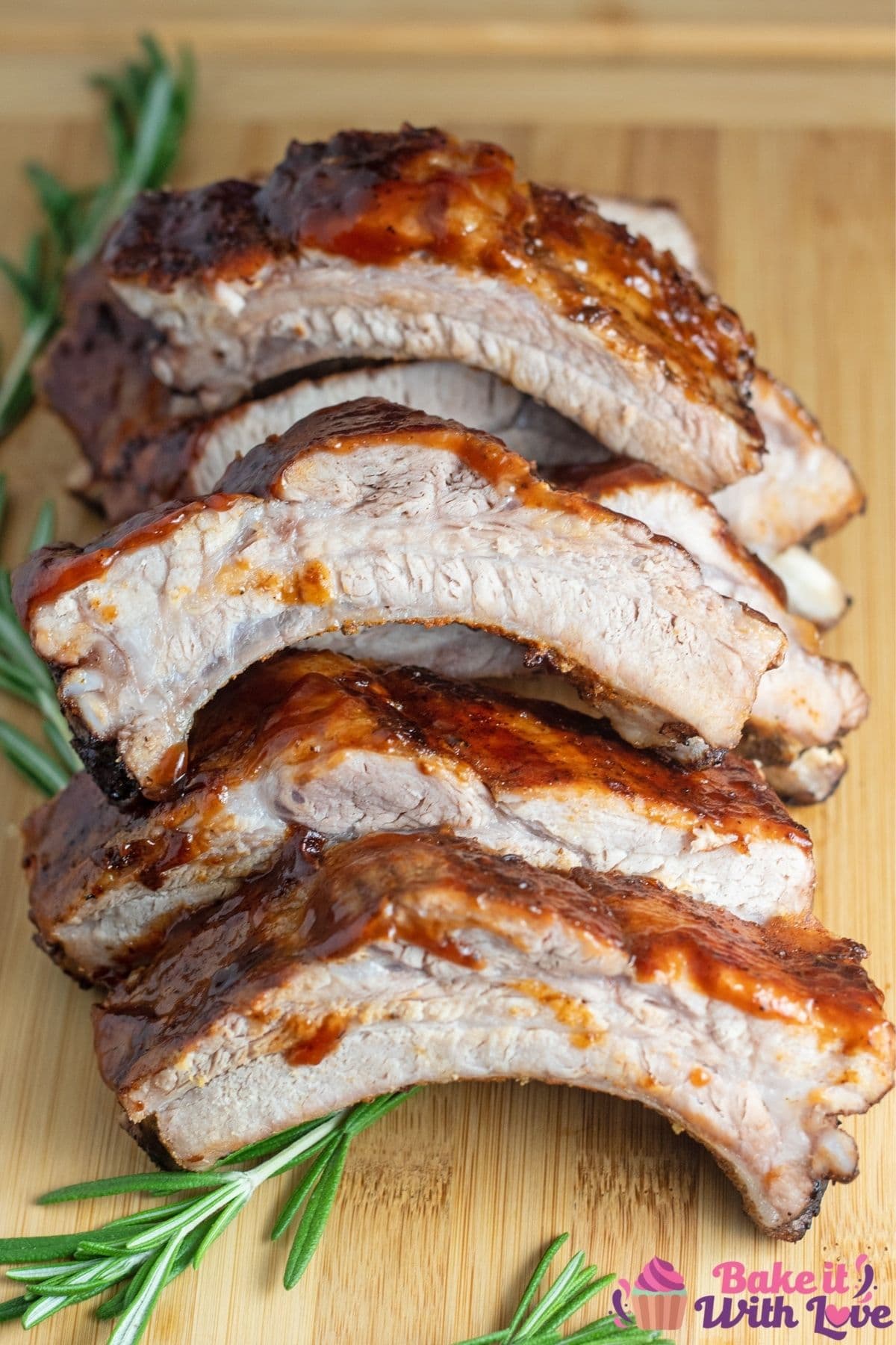 Tall image of bbq baby back ribs on a cutting board.