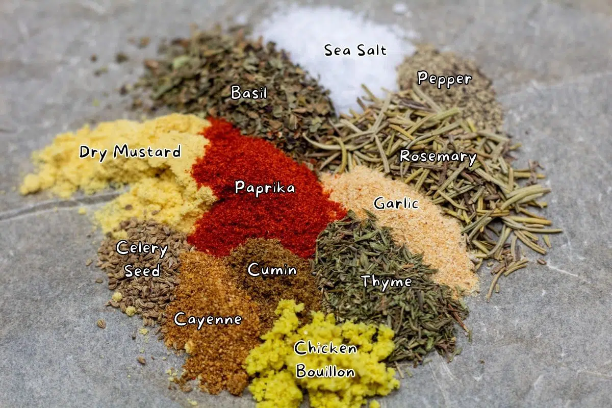 Chicken seasoning spices arranges in small piles with labels.
