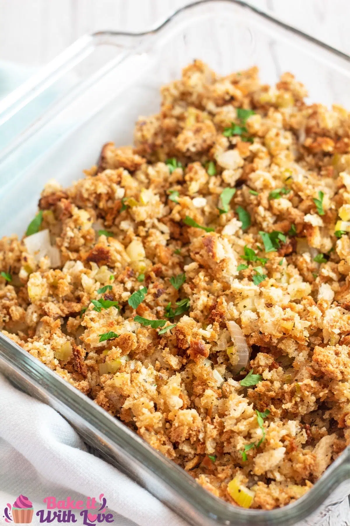 Tall overhead of the stuffing served in glass baking dish.