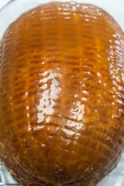 Process photo 4 showing glaze over uncooked ham.