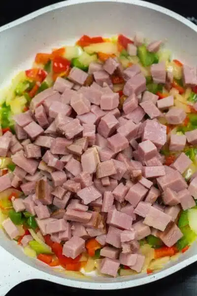 Process photo 4 add cubed cooked ham and heat with the sauteed vegetables.