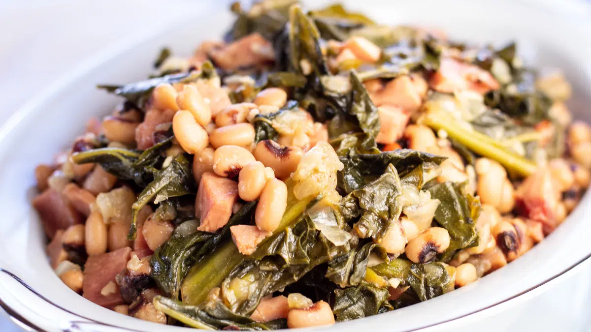 Black eyed peas with collard greens and ham ready to serve.