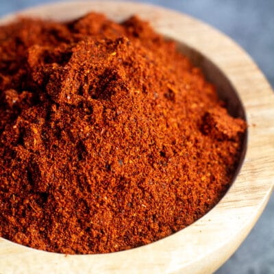 Square image of chili powder in a small bowl.