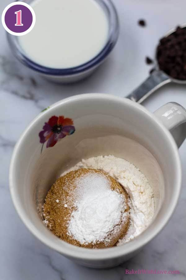 Chocolate chip mug cake process photo 1 showing the dry cake ingredients in a coffee mug.