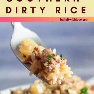 Pin image with text overlay of dirty rice with fork taking a bite.