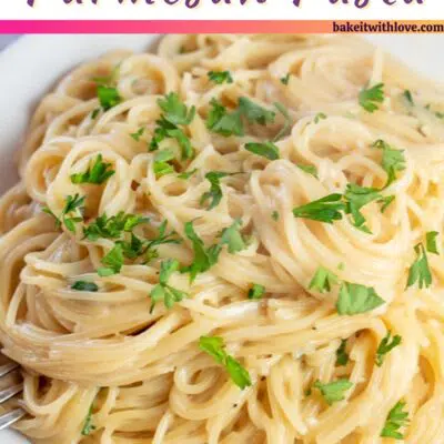Pin image with text of garlic Parmesan angel hair pasta on white plate.