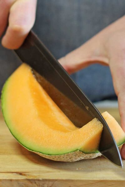 Cutting cantaloupe wedges 2.