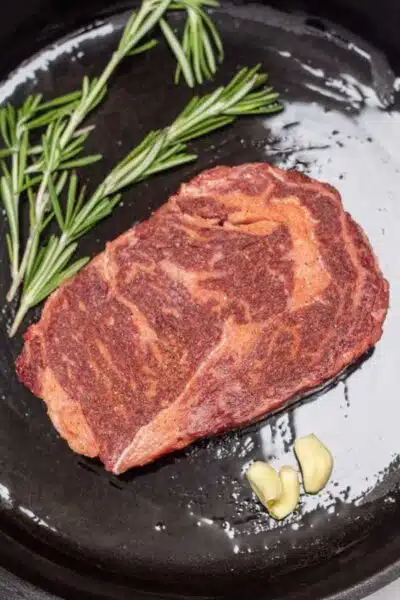 Wagyu steak process photo showing steak in cast iron.